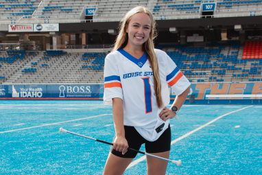 Image 2 of 4, picture of student in white jersey on the blue to promote Game Days