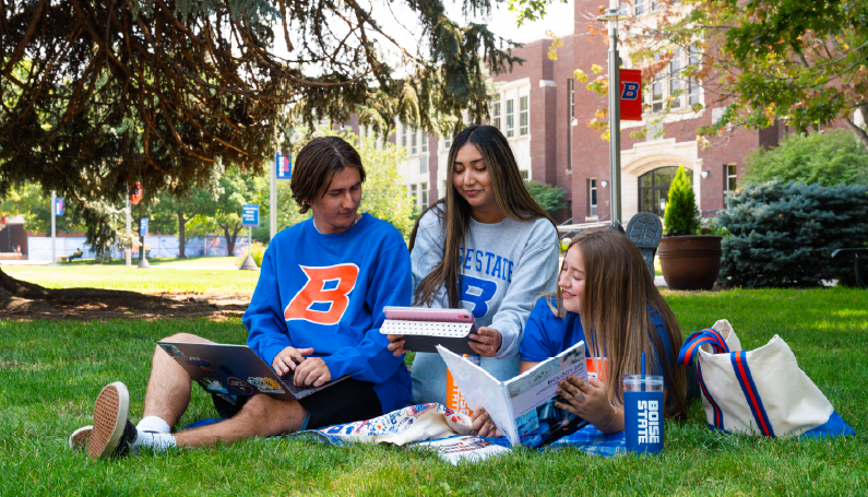 Boise State students on campus with apparel and accessories featuring the Boise State B logo
