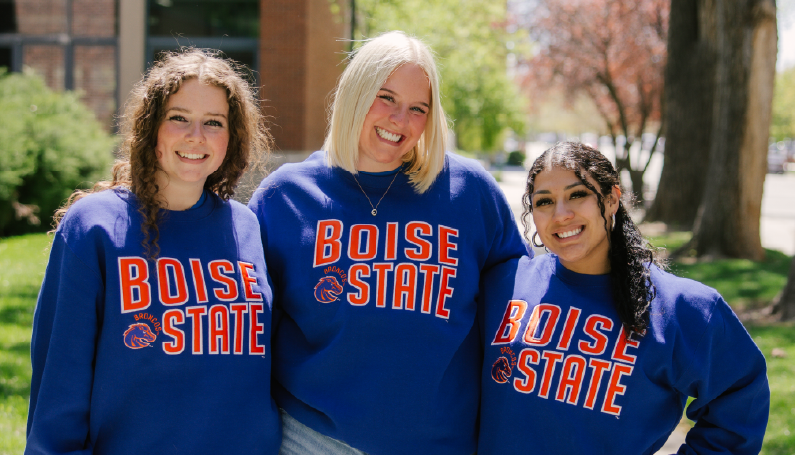 Slideshow image of 3 women in newly arrived Bronco Shop Sweaters